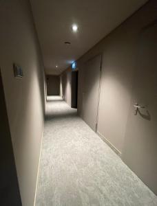 an empty room with a hallway with a door at City Centre Platinum Towers Apartment in Warsaw
