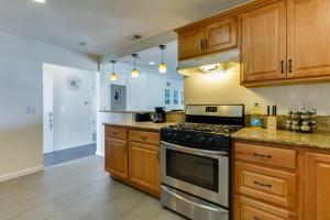 a kitchen with wooden cabinets and a stove top oven at 5 Bedroom Charmer in Granada Hills in Granada Hills