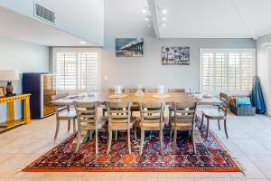 a dining room with a large wooden table and chairs at Ocean Pacific Neptune C in Oceanside