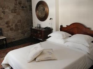 A bed or beds in a room at Casa Museu