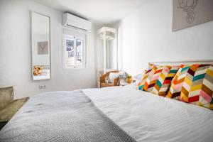 מיטה או מיטות בחדר ב-Casa Corbeto 7