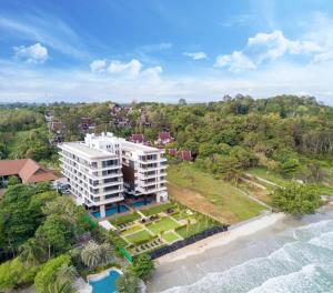 an aerial view of a resort on the beach at Mae Phim Escape Beachfront Apartments in Mae Pim