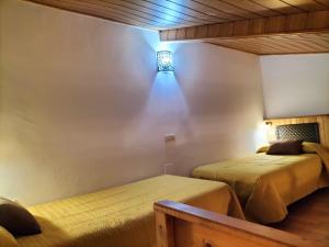 Postel nebo postele na pokoji v ubytování Don Camino + 2 fotografie
