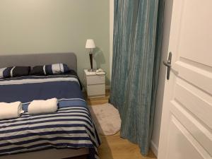 Posteľ alebo postele v izbe v ubytovaní Appartement T2 Paray vieille poste