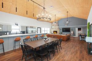 a dining room and kitchen with a table and chairs at Mountain Views I Pool&Hot Tub I Home for 20 Guests in Concan