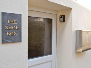 a door with a sign that reads the shoe box at The Shoe Box in Northam