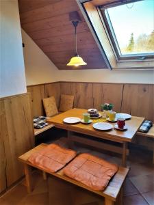 a dining room with a table and a window at Pension Ober in Siegsdorf