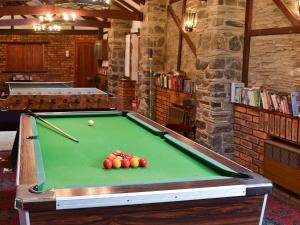 a pool table with balls on it in a room at Mill Apartment - Ukc3784 in West Down