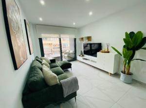Televízia a/alebo spoločenská miestnosť v ubytovaní Residencial Alegria 12 Torrevieja