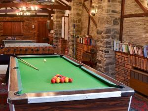 a pool table with balls on it in a room at Croyde - Ukc3785 in West Down