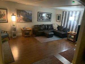 a living room with a couch and a table at Casa de Basswood in Tucson