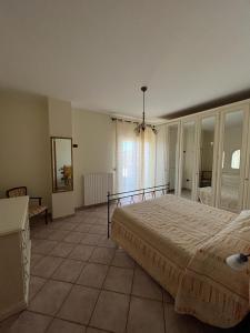 En eller flere senge i et værelse på Villa Margherita