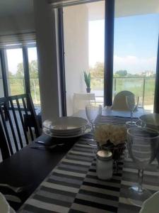 a dining room table with a black and white table cloth at Mountainview residency in Belek
