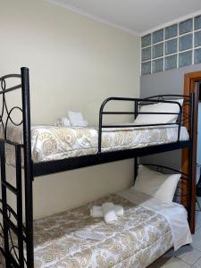 Postel nebo postele na pokoji v ubytování Pinpoint Rooms