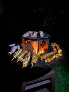 a grill with a bunch of food on it at Les Catèdjes in Fraize