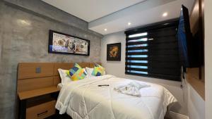 Cama ou camas em um quarto em Hotel La Serena