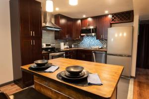 a kitchen with a wooden table with two bowls on it at 5124 Williams Fork in Boulder