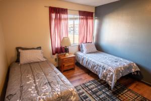 a bedroom with two beds and a window at 5124 Williams Fork in Boulder