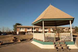 a gazebo with two chairs and a bench at 5124 Williams Fork in Boulder