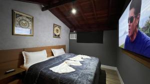 Cama ou camas em um quarto em Hotel La Serena