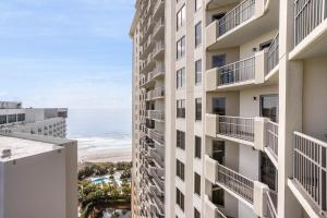 a view of the beach from the balcony of a building at Ocean View 3 Bedroom Unit #1607 Royale Palms condo in Myrtle Beach