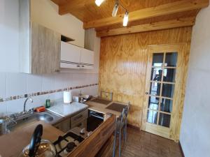 Kuchyň nebo kuchyňský kout v ubytování Hostal Yurak