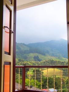a window with a view of a mountain at Casa Borbon in Salento