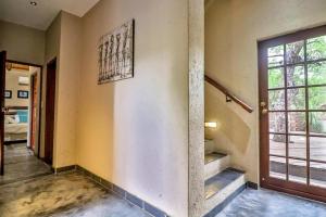 Postel nebo postele na pokoji v ubytování Luxury Kruger Escape