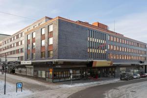 a large building on the corner of a street at Best Western Plus Grand Hotel Elektra in Ludvika