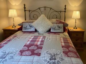 a bedroom with a bed with two night stands at Ardlui Church in Ardlui