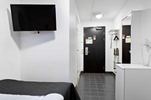 Televiisor ja/või meelelahutuskeskus majutusasutuses Best Western Centralhotellet