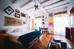 a bedroom with a large bed and a table at DUOMO - The Warm Maison - EXCLUSIVE in Milan