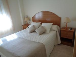 Postel nebo postele na pokoji v ubytování Hostal El Retiro