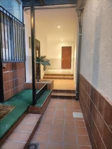 an empty hallway of a building with a door at HABITACION EN CHUECA, CENTRO DE MADRID in Madrid