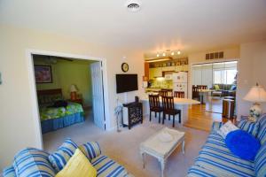 a living room with a couch and a table at Club Ocean Villas II 19 condo in Ocean City