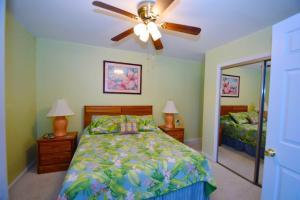 a bedroom with a bed and a ceiling fan at Club Ocean Villas II 19 condo in Ocean City