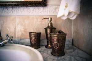 a bathroom counter with a sink and a faucet at Chateau du Mur in Comblessac +33 photos
