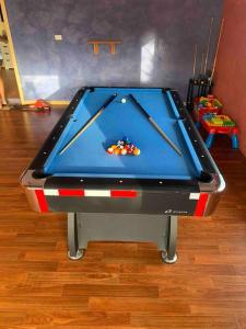 a pool table with cue balls on top of it at A picturesque 3 bedroom house with splendid views in Atherton