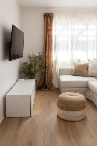 a living room with a white couch and a table at The Laurel Loft in San Diego