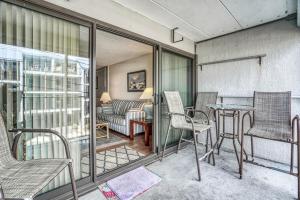 a living room with a couch and a table and chairs at Oceana II 109 condo in Ocean City