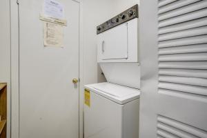 a white washer and dryer in a small bathroom at Oceana II 109 condo in Ocean City +21 photos