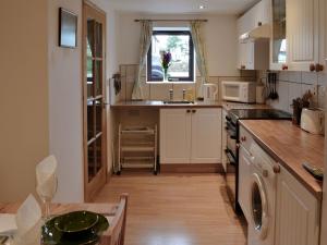 a kitchen with a sink and a counter top at Midday in Silloth