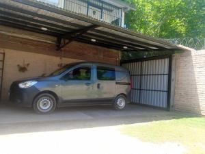 a small van is parked in a garage at Alojaserve in San Rafael +6 photos