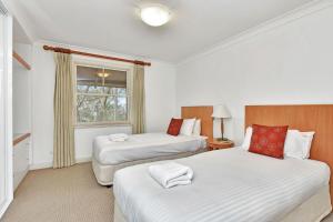 Postelja oz. postelje v sobi nastanitve Villa 3br Syrah Villa located within Cypress Lakes Resort
