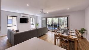 a living room with a couch and a table at Tasman Holiday Parks - Moama on the Murray in Moama
