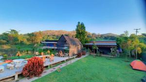 an aerial view of a house with a yard at MTT resort in Ban Nam Tok Mae Klang +6 photos
