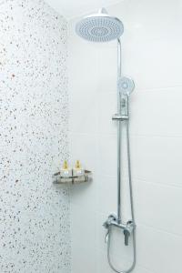 a shower with a shower head in a bathroom at BOBO Boutique Hotel in Vung Tau +50 photos