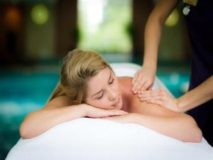 a woman getting a massage in a hot tub at Aqua Tropical Resort Next to Al Gouna in Hurghada