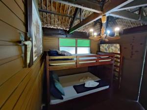 a small room with bunk beds in a cabin at Tanaw sa Anilao in Mabini