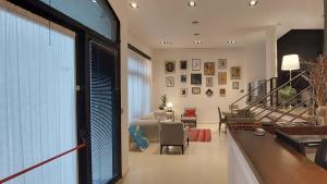 a living room with a large window and a couch at Hotel Rawson 3840 in La Lucila